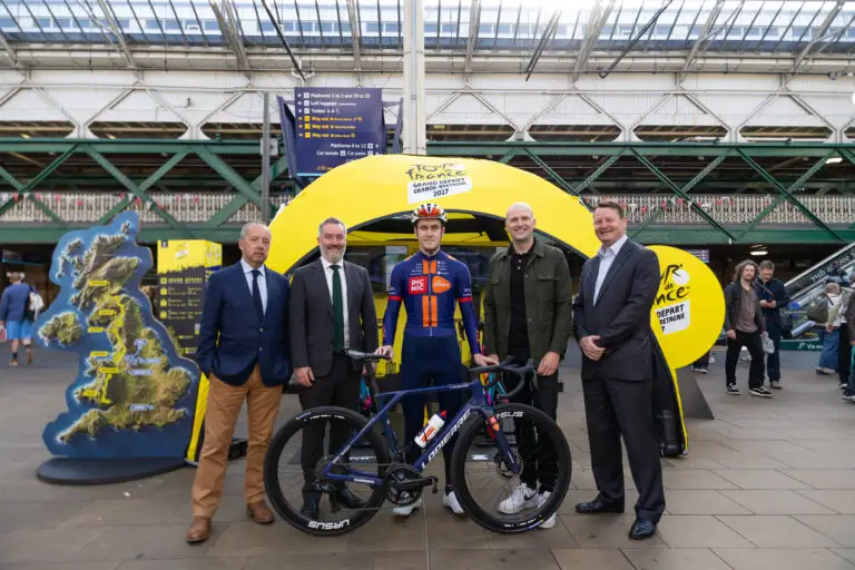 Dignitaries join procyclist Sean Flynn at Edinburgh Waverley railway station to celebrate one year to go.